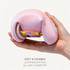 A hand bending a pink STEPGLO slide almost in half to show how flexible the foam is. Caption on the image: Soft and flexible, lightweight EVA, all-day comfort.