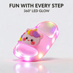 A single pink STEPGLO slide on a white background with LEDs lit right around the sole. Caption on the image: Fun with every step, 360 degree LED glow.