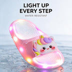 A pink STEPGLO slide standing in shallow water with droplets on the foam and the LEDs lit. Caption on the image: Light up every step, water-resistant.